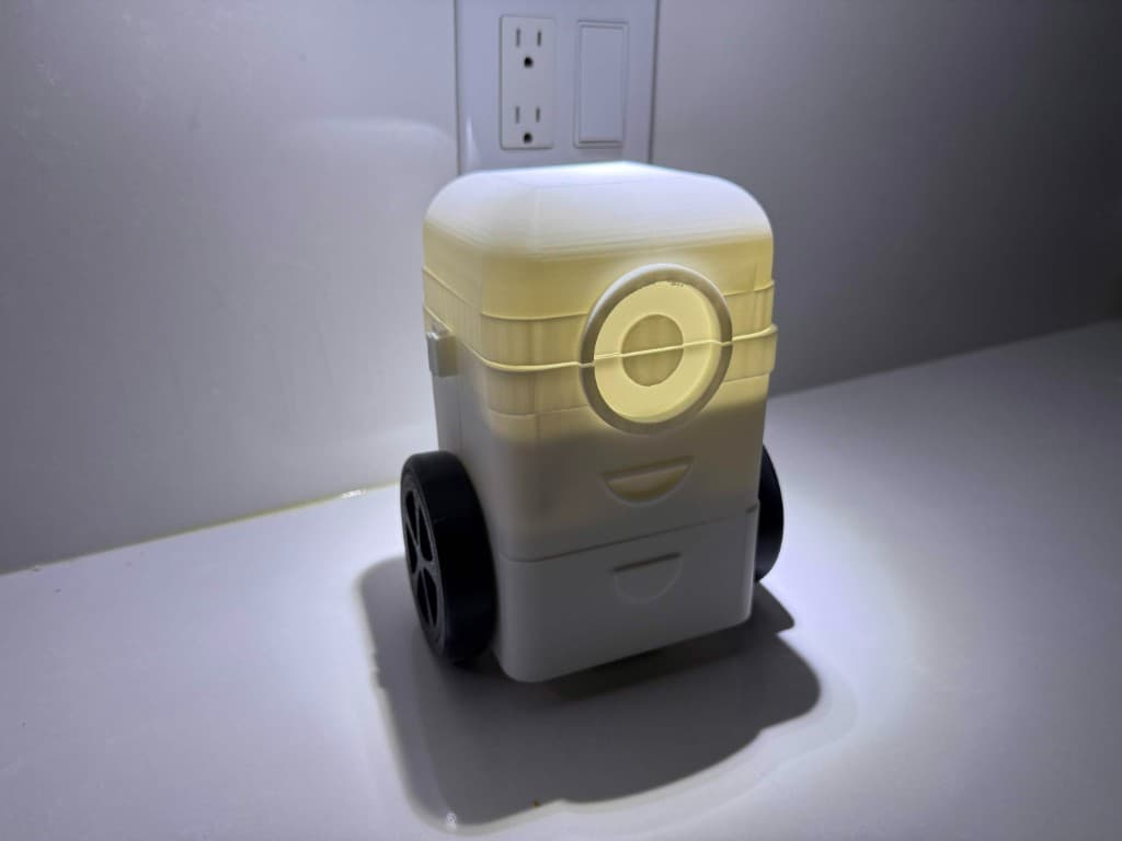 3D-printed self-balancing robot body with glowing eye and dual wheels